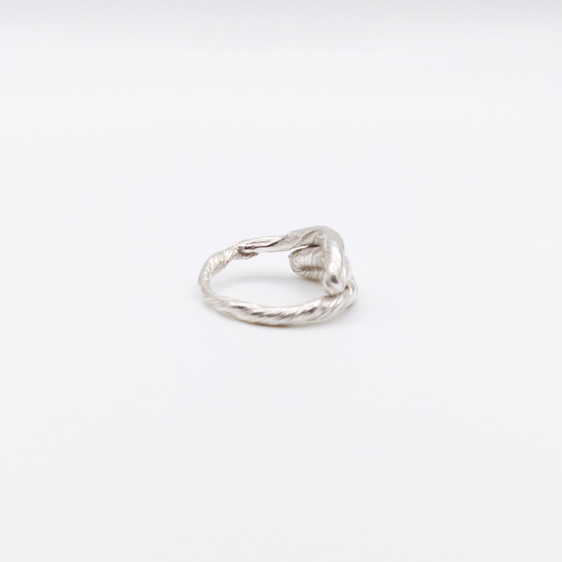 Side view of the Anchor silver ring, pictured on a light plain background.