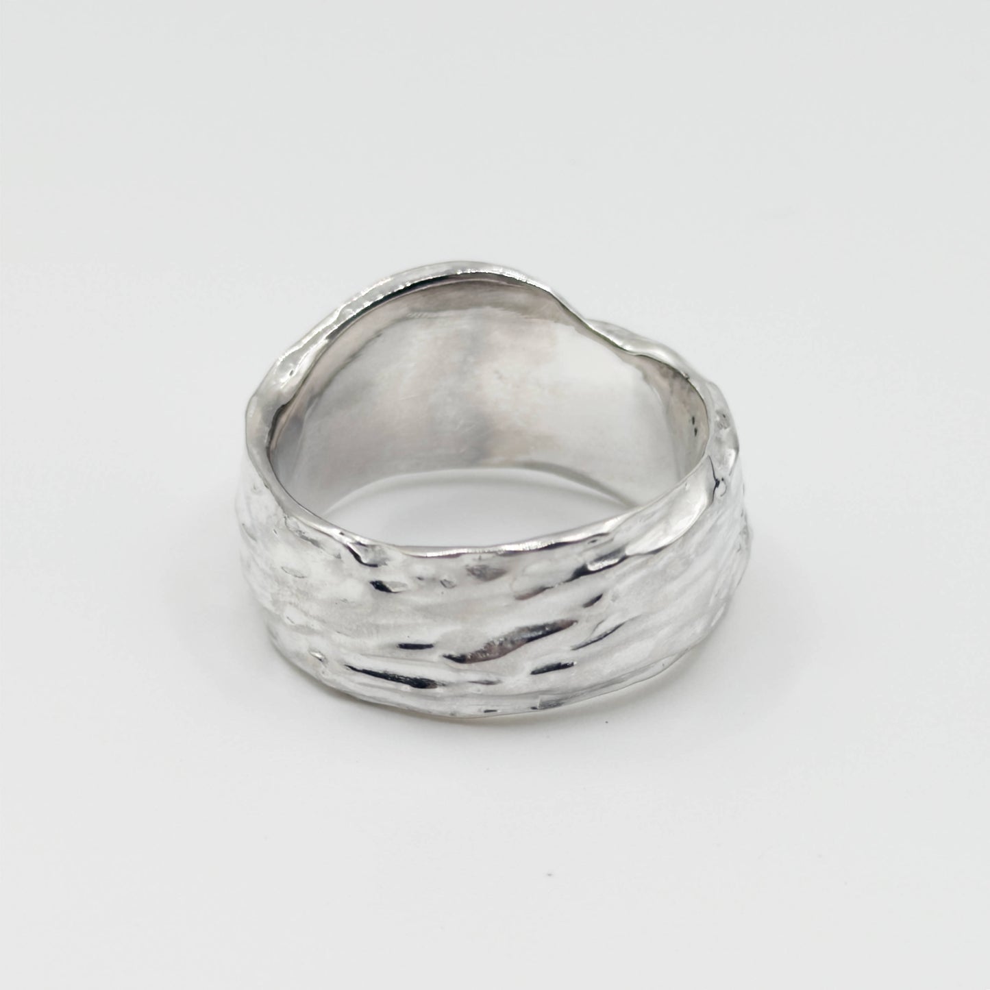 Back view of the Canyon sample silver ring, pictured on a light plain background.