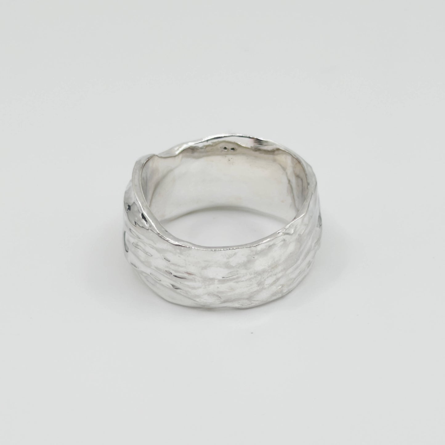 Back view of the Canyon sample silver ring, pictured on a light plain background.