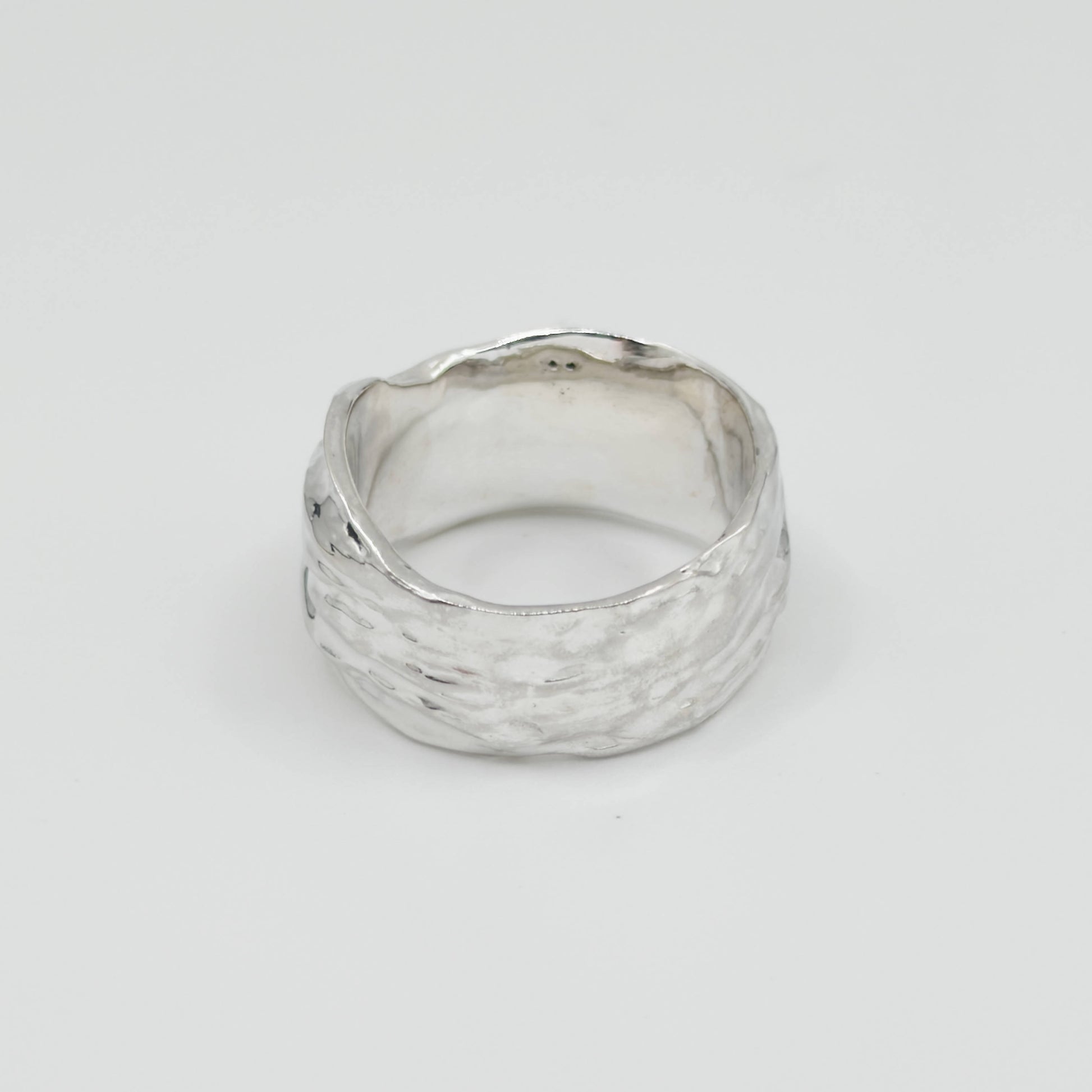 Back view of the Canyon sample silver ring, pictured on a light plain background.