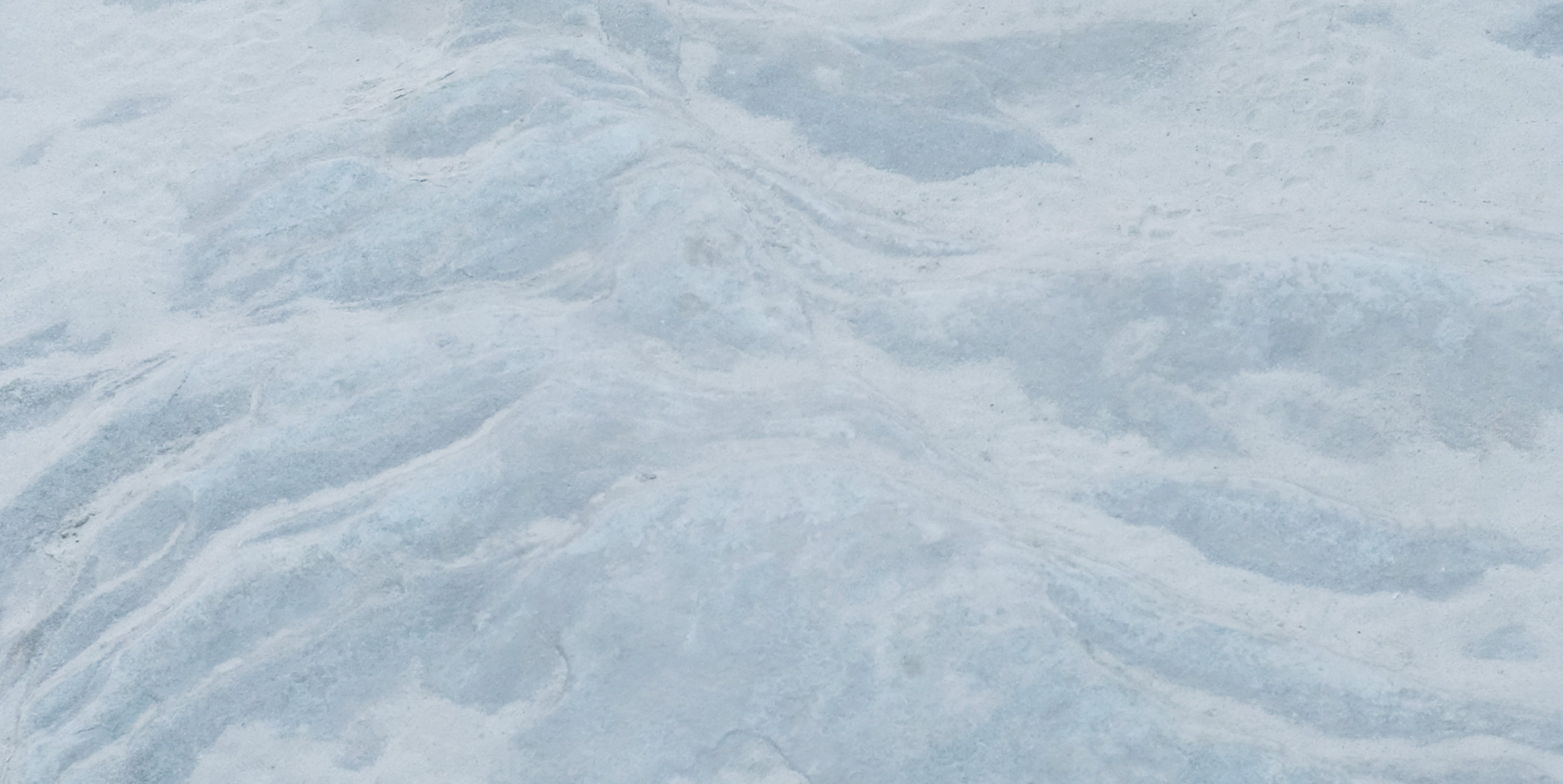 Textured blue surface with wavy patterns