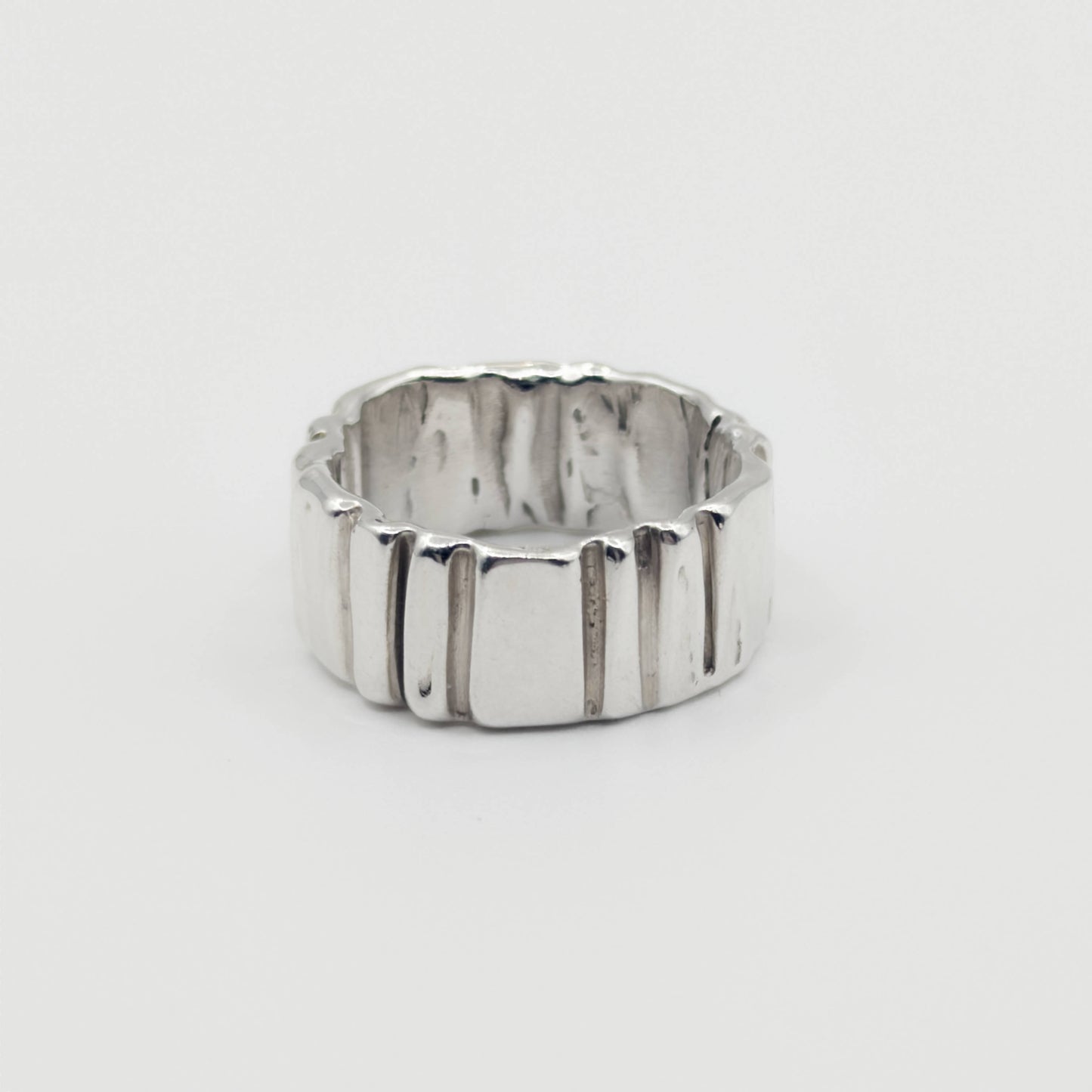Front view of the Ripple silver ring, pictured on a light plain background.