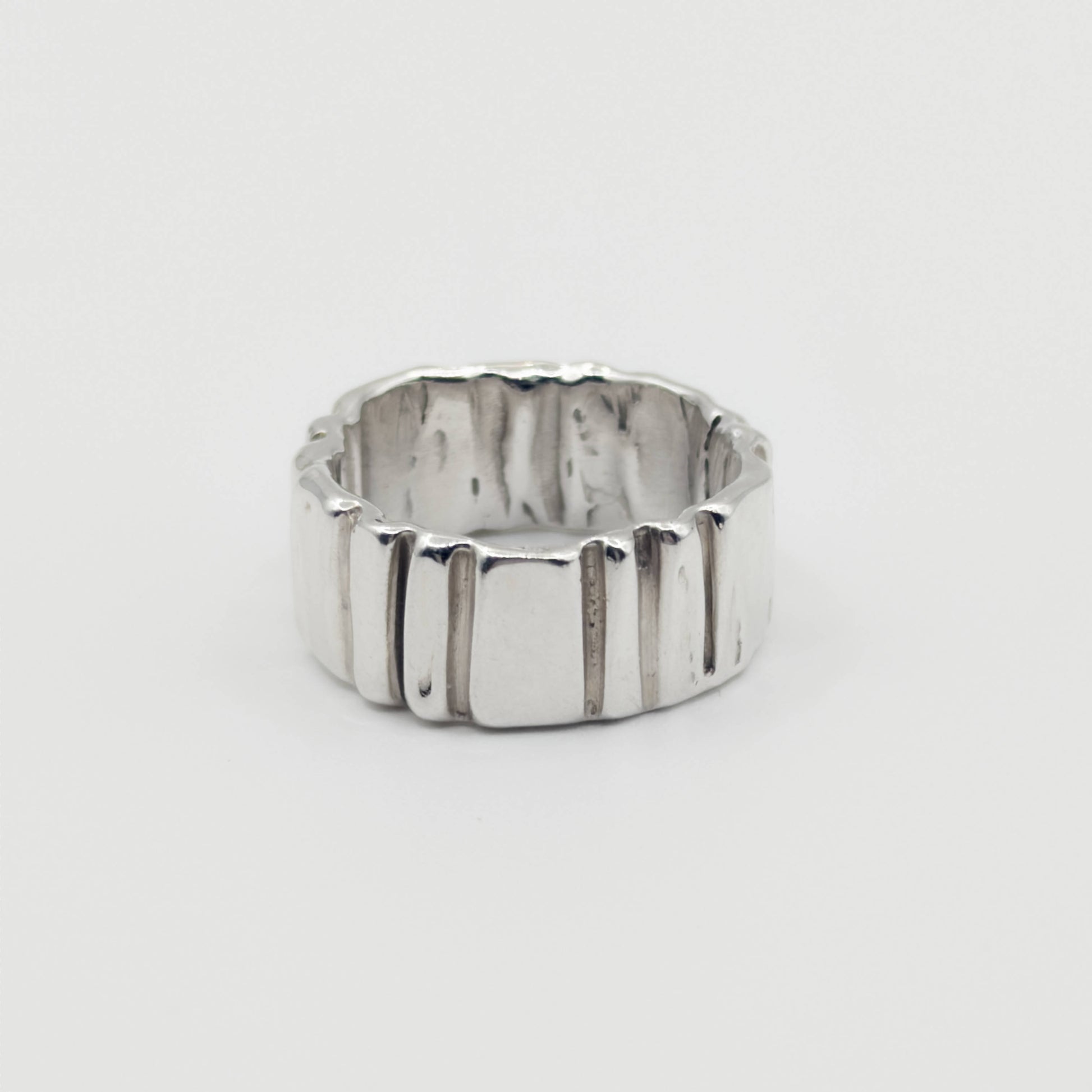 Front view of the Ripple silver ring, pictured on a light plain background.