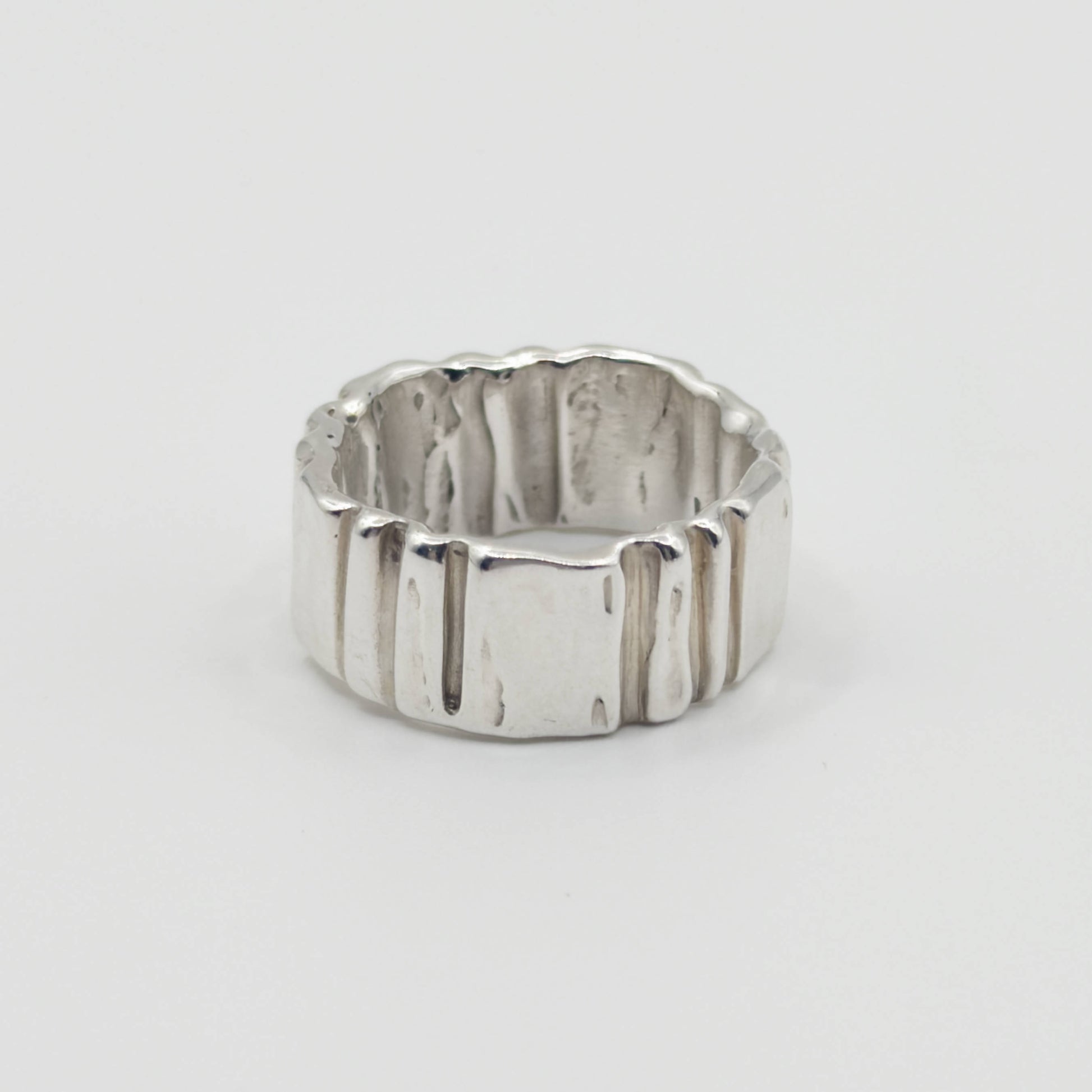 Back view of the Ripple silver ring, pictured on a light plain background.